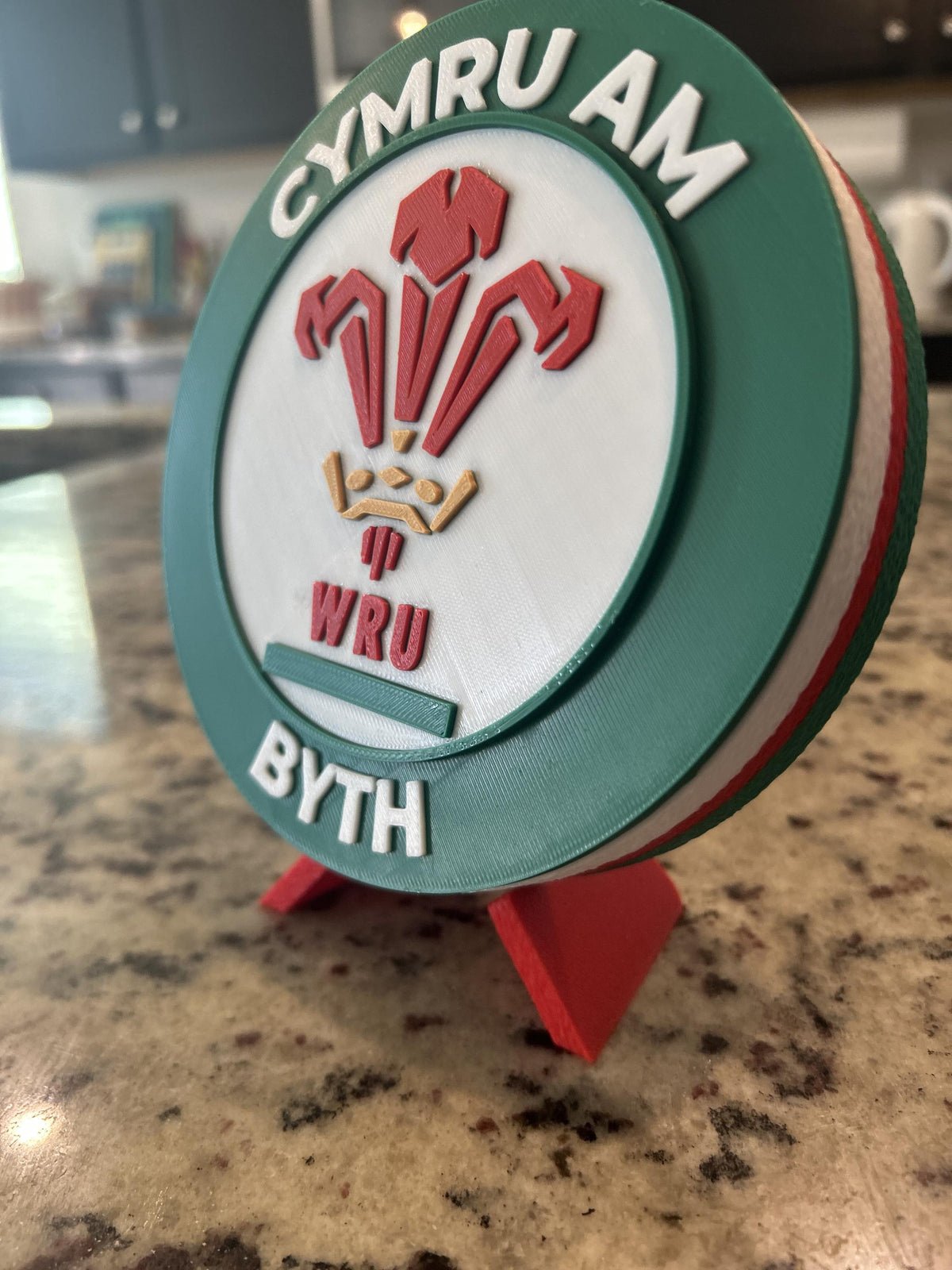 Wales rugby WRU 3D printed feathers crest roundel with Welsh tricolor base and green stand and hidden stash box, personalized Cymru am Byth rugby fan gift, made in USA