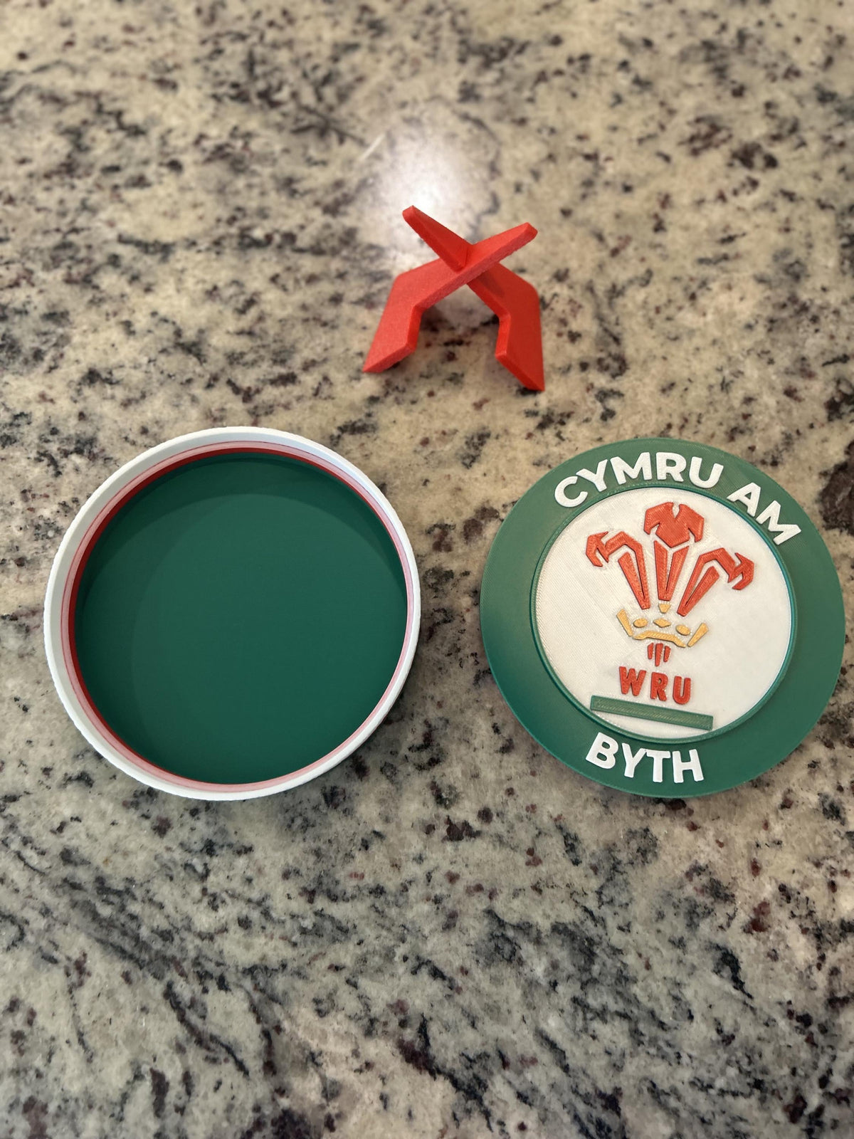 Wales rugby WRU 3D printed feathers crest roundel with Welsh tricolor base and green stand and hidden stash box, personalized Cymru am Byth rugby fan gift, made in USA