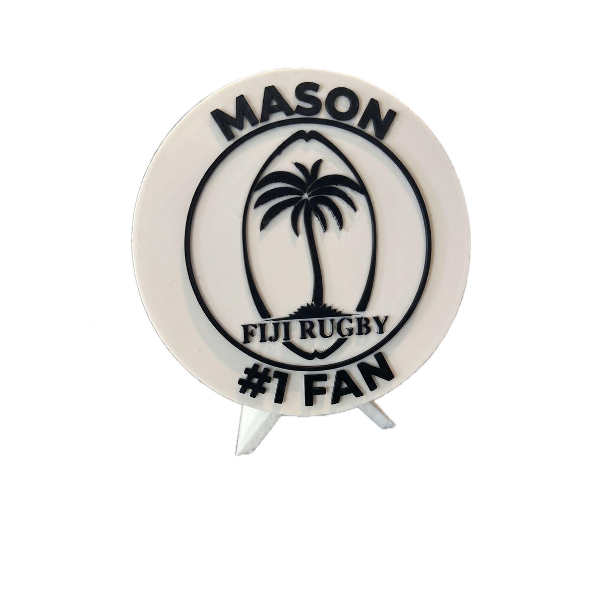 Personalized rugby roundel example with the name MASON on top and #1 FAN on the bottom, 3D printed to order