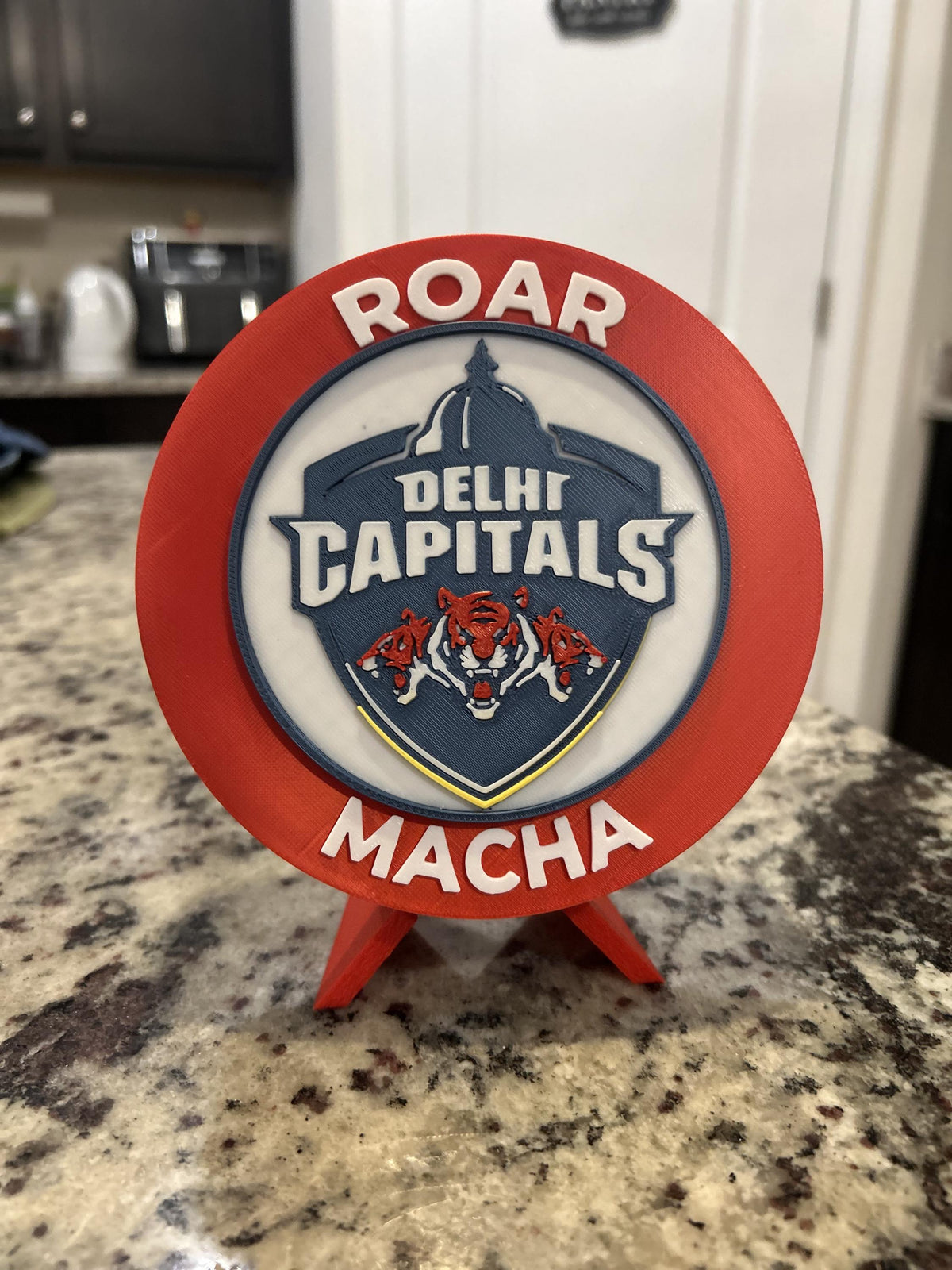 Delhi Capitals 3D printed red roundel display with stand and hidden stash box, personalized Roar Macha IPL cricket fan gift, made in USA