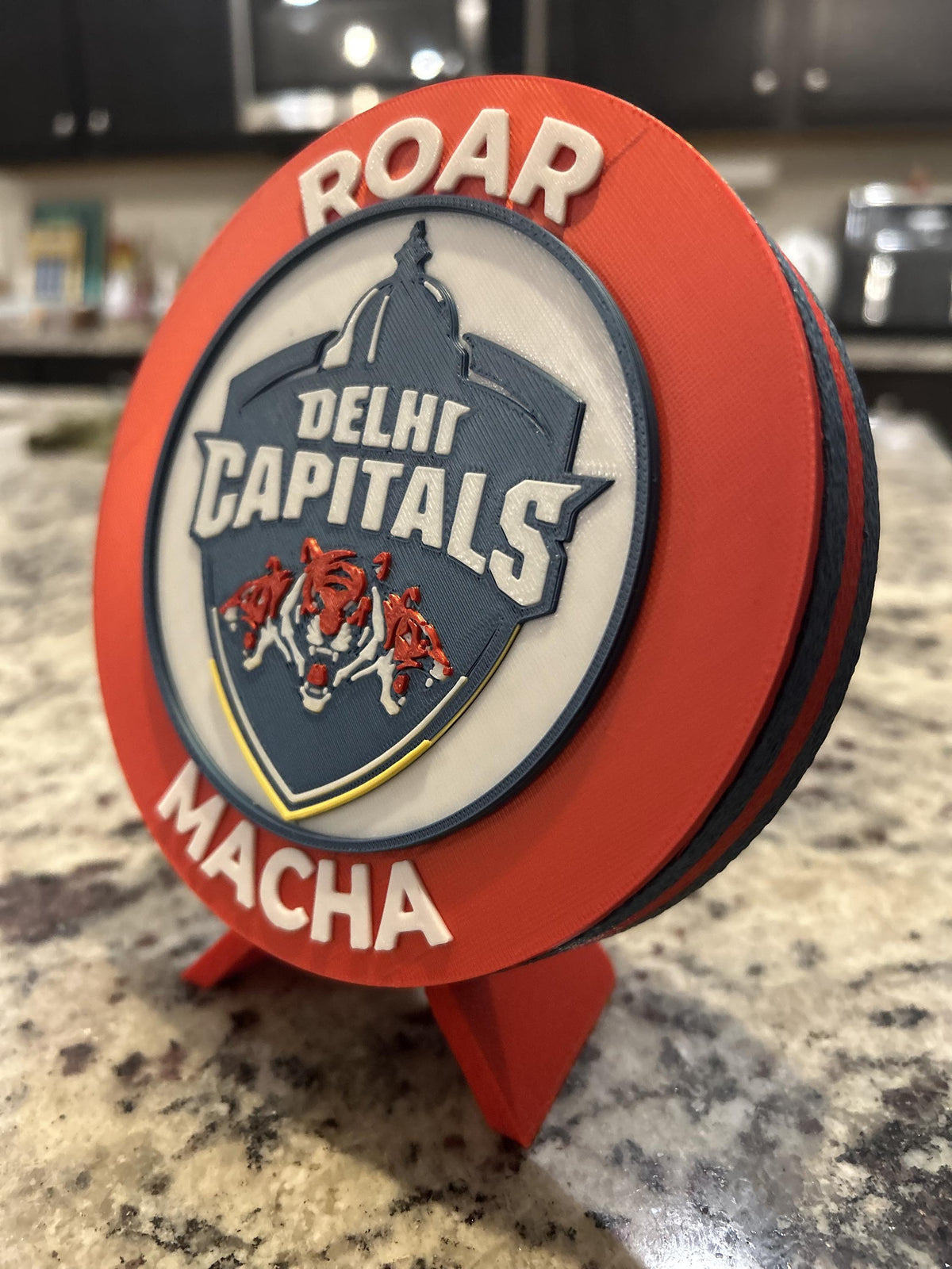 Delhi Capitals 3D printed red roundel display with stand and hidden stash box, personalized Roar Macha IPL cricket fan gift, made in USA