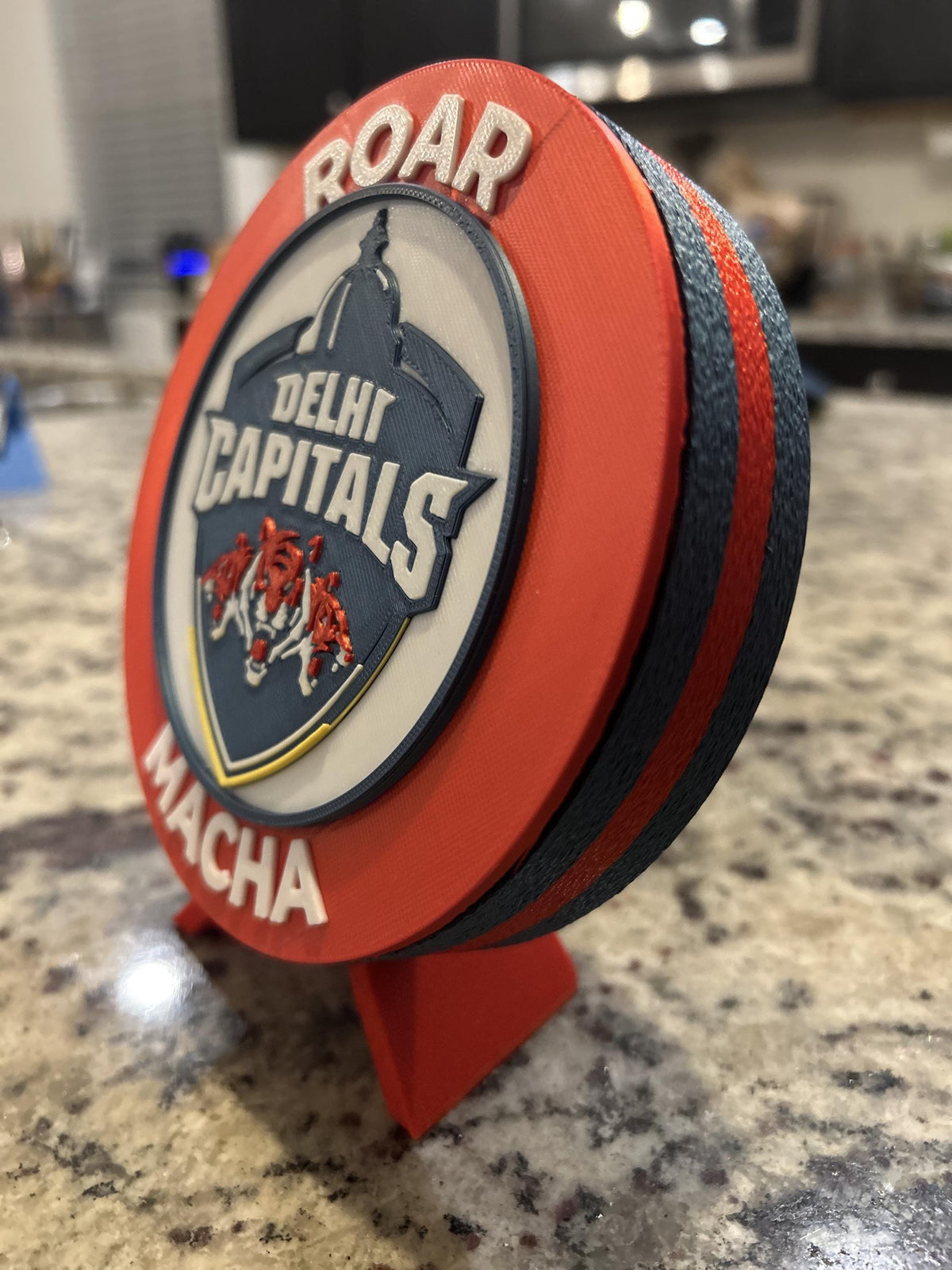 Delhi Capitals 3D printed red roundel display with stand and hidden stash box, personalized Roar Macha IPL cricket fan gift, made in USA