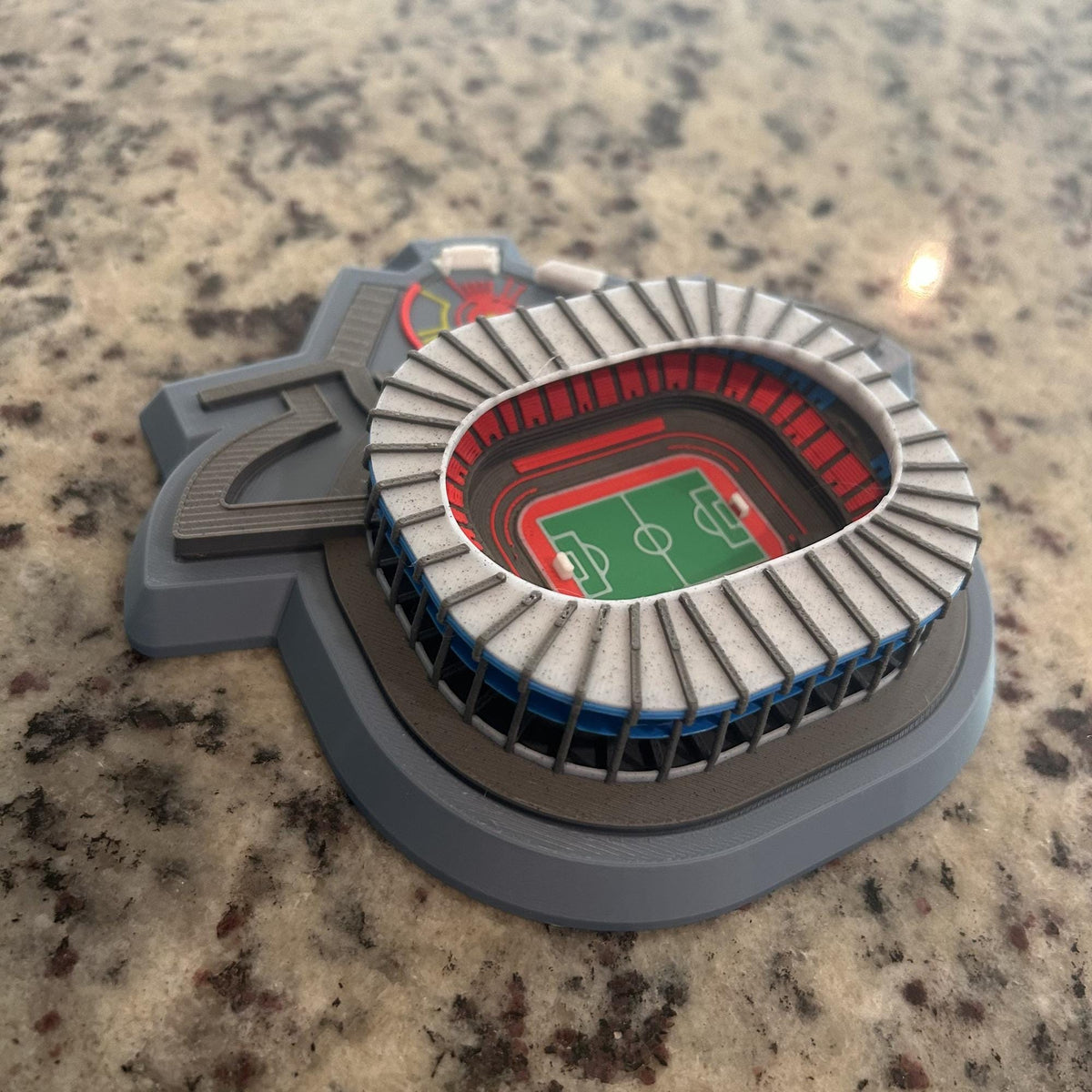 Multicolor 3D printed Estadio Azteca model showing seating tiers, blue concourse rings and green pitch, Mexican soccer fan collector gift, no paint, made in USA