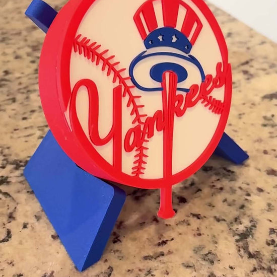 Customized New York Yankees 3D printed plaque on a countertop, showcasing vibrant colors and unique design.