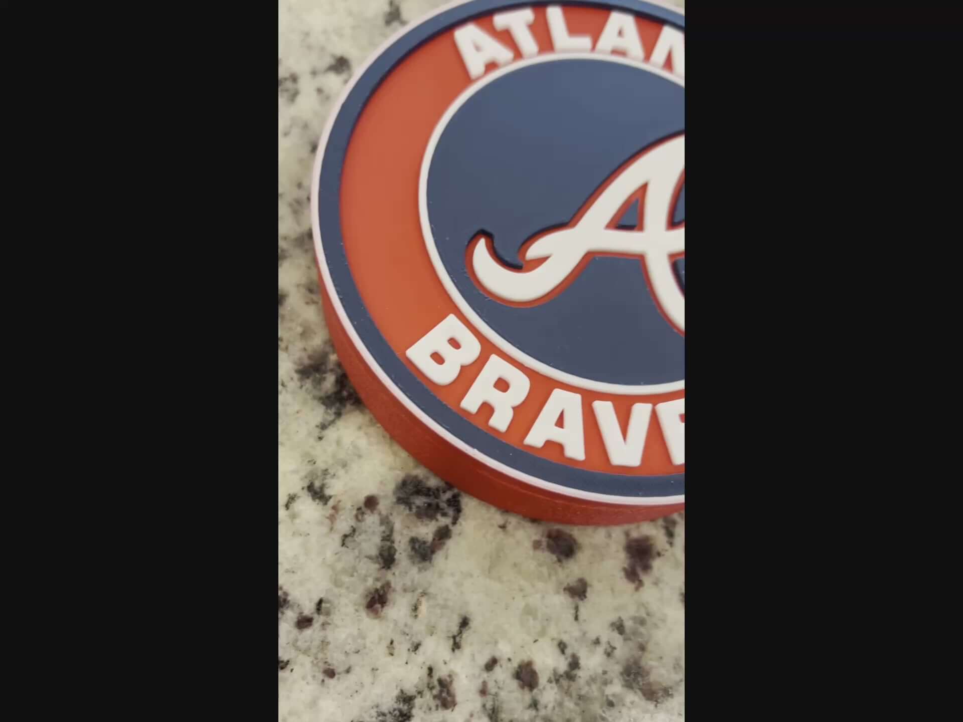 Load video: Atlanta Braves 3D printed MLB logo plaque showcasing vibrant colors and high-quality materials for baseball fans.