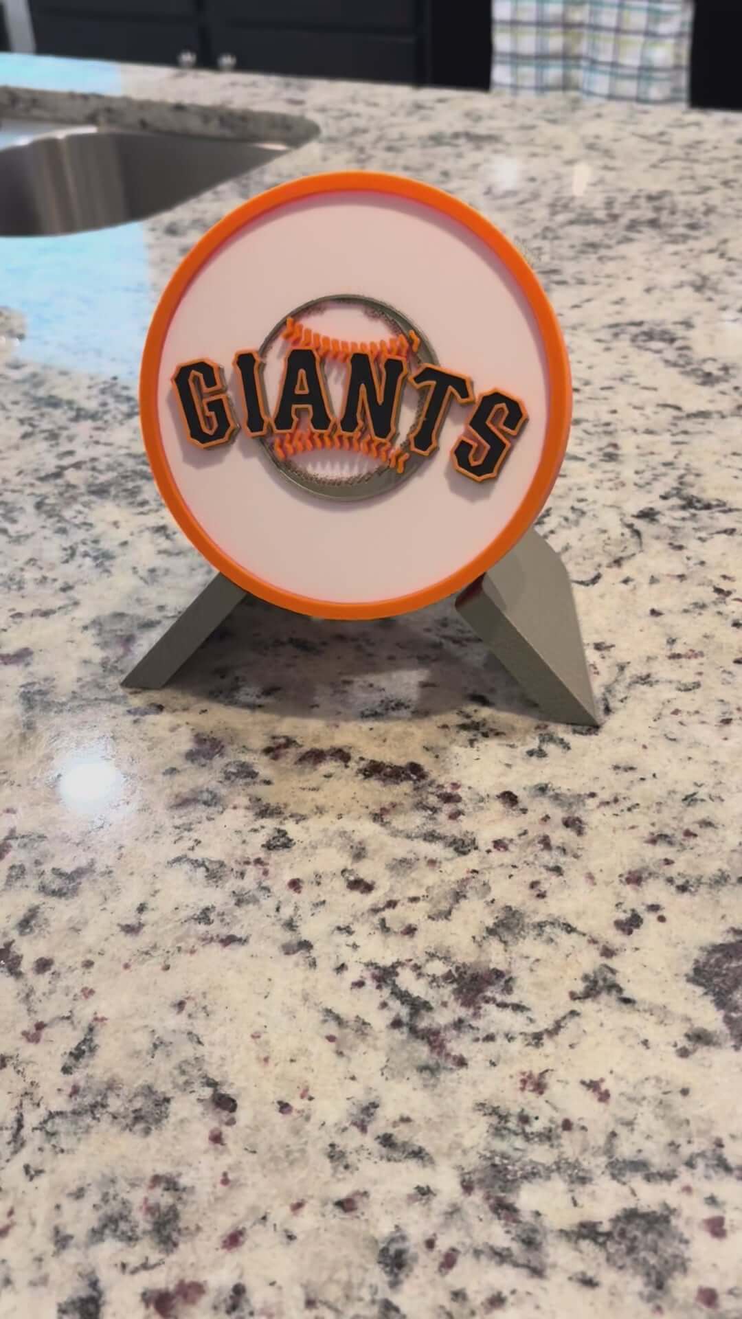 Load video: 3D printed San Francisco Giants plaque on a countertop, vibrant colors, no assembly required, perfect sports decor.