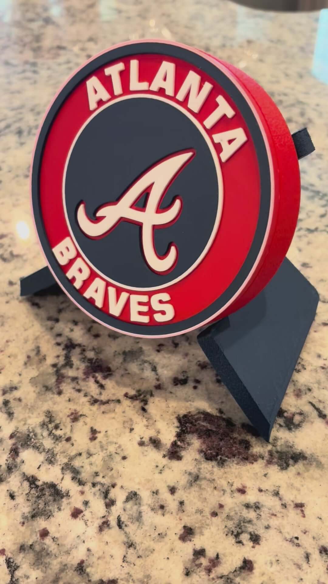 Load video: 3D printed Atlanta Braves MLB plaque in vibrant colors, perfect for baseball decor and fan gifts.