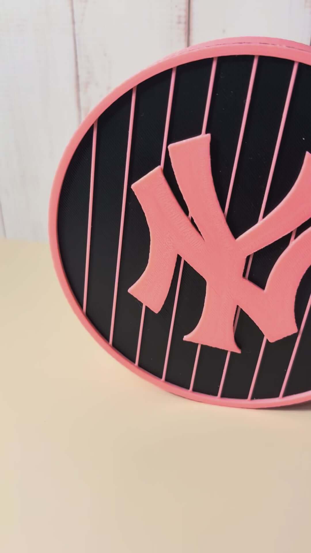 Load video: NY Yankees 3D logo stash box in pink, showcasing vibrant colors and unique design, perfect for baseball fans.