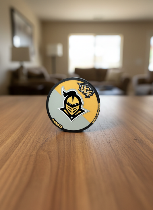 UCF Knights 3D printed logo display in black and gold on desk with built-in stand
